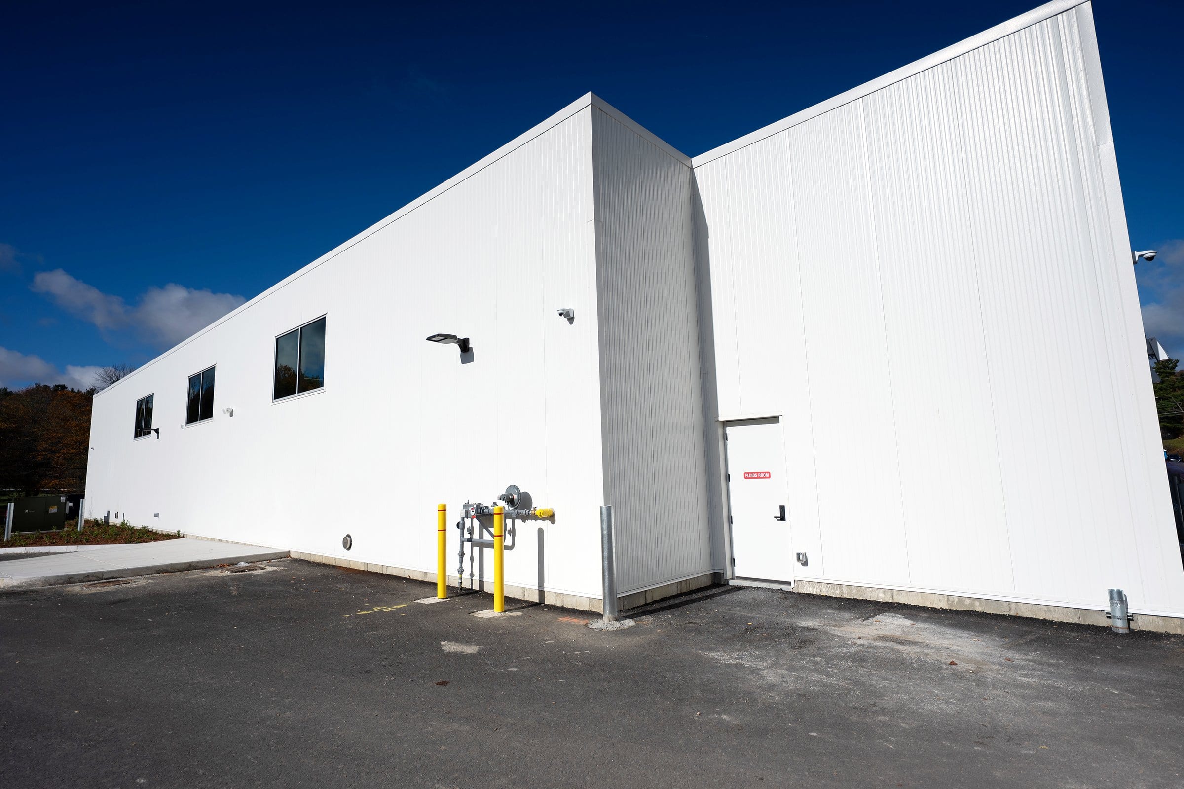 White insulated metal panel service building RSNE put up for McGee BMW, Audi and VW in Lenox, MA